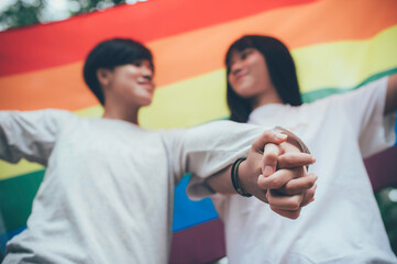 Couple of girl with girl,LGBT Pride month concept,Asian Handsome male make up and wear woman cloth,Gay Freedom Day,Portrait of Non-binary on white background