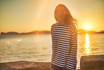 Smelling caucasian women relaxing on beach, so happy in holiday summer, outdoors sunset sky background. Travel and lifestyle Concept,  Summer Vacation. 
