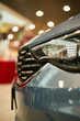 Headlights of a sports car in gray. Close-up photo of car headlights. car lights on bokeh background