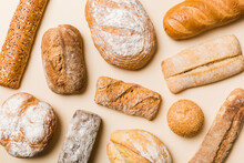 Homemade Natural Breads. Different Kinds Of Fresh Bread As Background, Top View With Copy Space