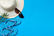 Summer Vacation Concept Flat Lay. Straw Hat Beach Accessories And Towel Top View. Space For Text. Travel Concept