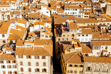 Aerial view on the beautiful rooftops of ancient houses and streets in Florence on sunny day