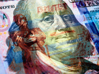 Wall Mural - fragments of russian and american paper money closeup. ruble and dollar. a banknote of 5000 rubles a