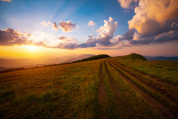 Wall Mural - Breathtaking view of the sunset over the mountain ranges. Carpathian mountains, Ukraine.