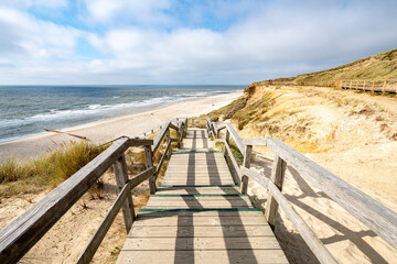Wall Mural - wooden stairs leading to the beach near the rotes kliff (red cliff), kampen, sylt, schleswig-holstei