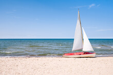 Sail Boat On The Beach In Summer