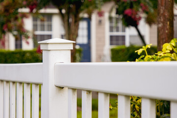 White garden fence outside home