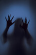 © releon8211 - Ghost concept shadow of a women behind the matte glass blurry hand and body soft focus