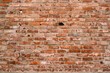 © sandipruel - Brick wall of the building. Designer building background.