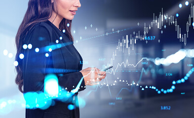 Wall Mural - Businesswoman with phone in hands, stock market hologram chart