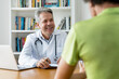 © Daniel Ernst - Doctor with gray hair has good news for patient