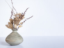 Dried Preserved Plant And Grass In A Vase Isolated Over Grey Background, Minimalism Design. High Quality Photo