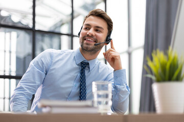 Sticker - Smiling friendly handsome young male call centre operator.