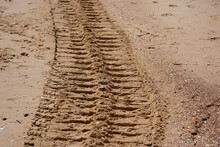 Tire Tracks In Sand