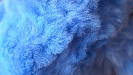  Blue faux fur. long pile. Children's toy. Piece of clothing. animal protection. Substitute for natural fur. fabric production. close-up.