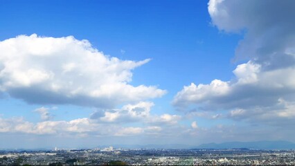 Fotobehang - 晴れの日の福岡市の風景のタイムラプス