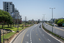 Elevated View Of Route 2 In Herzliya Towards Tel Aviv, Israel Ayalon, In Herzliya, Towards Tel Aviv-Yafo, Israel, With Buildings And An Israeli Flag.