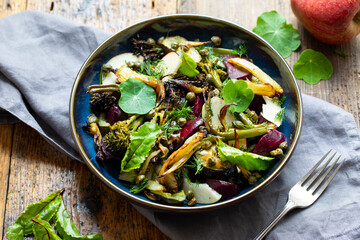 Wall Mural - Warm salad with roast beetroor, broccoli, apple, fennel and crispy capers