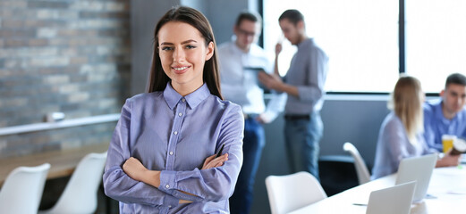 Wall Mural - Portrait of young businesswoman during meeting in office