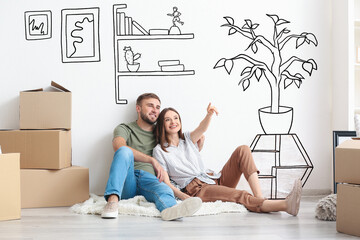 Wall Mural - Young couple with moving boxes planning design of their new house