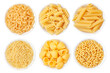Different types of pasta in a white cup on a white background. View from above