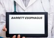 © luchschenF - Barrett Esophagus.  Doctor with rare or orphan disease text on tablet screen Barrett Esophagus