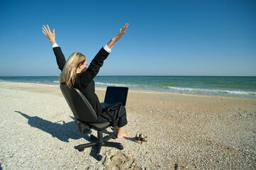 Business woman on the beach