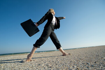 Business woman on the beach