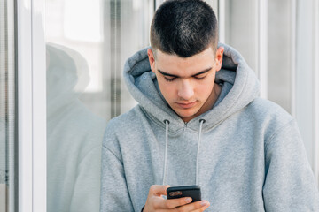 Sticker - teenage boy with mobile phone in the street