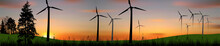 Eleven Wind Power Generators Silhouettes At Sunset