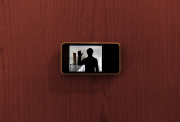 Monitor digital peephole watching a stranger outside the door