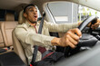 © Home-stock - frightened african american man driving car at high speed crash survivor Oops, shock reaction.