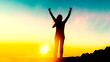 © Maridav - Happy woman sihouette with arms up for life success celebrating financial freedom early retirement on sunset glow sun at mountain summit. Wellness, healthy concept background. Goal achievement