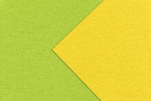 Texture Of Yellow And Green Paper Background, Half Two Colors With Arrow, Macro. Structure Of Dense Craft Cardboard.