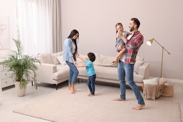 Wall Mural - Happy family spending time together at home