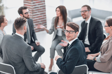 young employee sitting at a seminar on team building