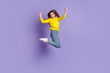 © Tetiana - Full body profile side photo of young girl jump celebrate luck fists hands awesome isolated over purple color background