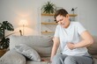 © Serhii - Senior adult woman touching back feeling backache, discomfort low lumbar muscular kidney pain. Elderly woman felt back pain after exercising, fitness exercises caused health problems in retirement.