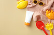 Summer sunscreen cream tube mockup, sunglasses, sand molds, towel top view. Baby sun protection concept.