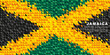 Flag of Jamaica. Abstract background of small triangles in the form of colorful green, black and yellow stripes of the Jamaican flag.