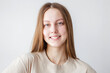 © Tatyana Gladskih - Portrait of young beautiful cute cheerful girl smiling over white background