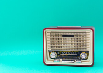 Antique radio isolated on blue background with copy space