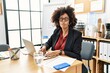 © Krakenimages.com - African american woman with afro hair working at the office wearing operator headset making fish face with lips, crazy and comical gesture. funny expression.