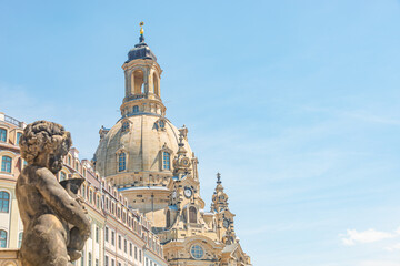 Wall Mural - Church of Our Lady at Neumarkt square in downtown of Dresden in summer sunny day with blue sky copy space, Germany, and a statue of a child in foreground.