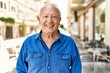 © Krakenimages.com - Senior man with grey hair standing happy outdoors on a sunny day. Smiling happy at 70s for retirement.