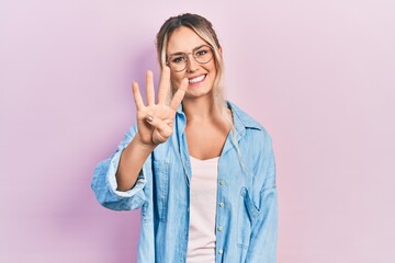 Poster - Beautiful young blonde woman wearing casual clothes and glasses showing and pointing up with fingers number four while smiling confident and happy.