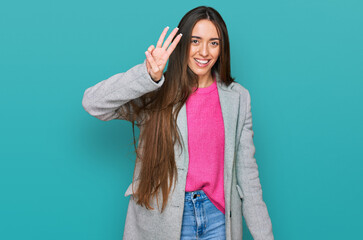 Sticker - Young hispanic girl wearing business clothes showing and pointing up with fingers number three while smiling confident and happy.