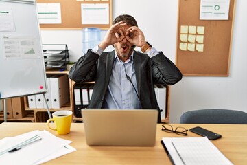 Sticker - Handsome middle age man wearing call center agent headset at the office doing ok gesture like binoculars sticking tongue out, eyes looking through fingers. crazy expression.