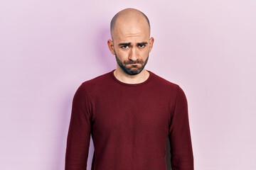 Sticker - Young bald man wearing casual clothes skeptic and nervous, frowning upset because of problem. negative person.