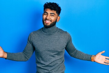 Poster - Arab man with beard wearing turtleneck sweater smiling showing both hands open palms, presenting and advertising comparison and balance